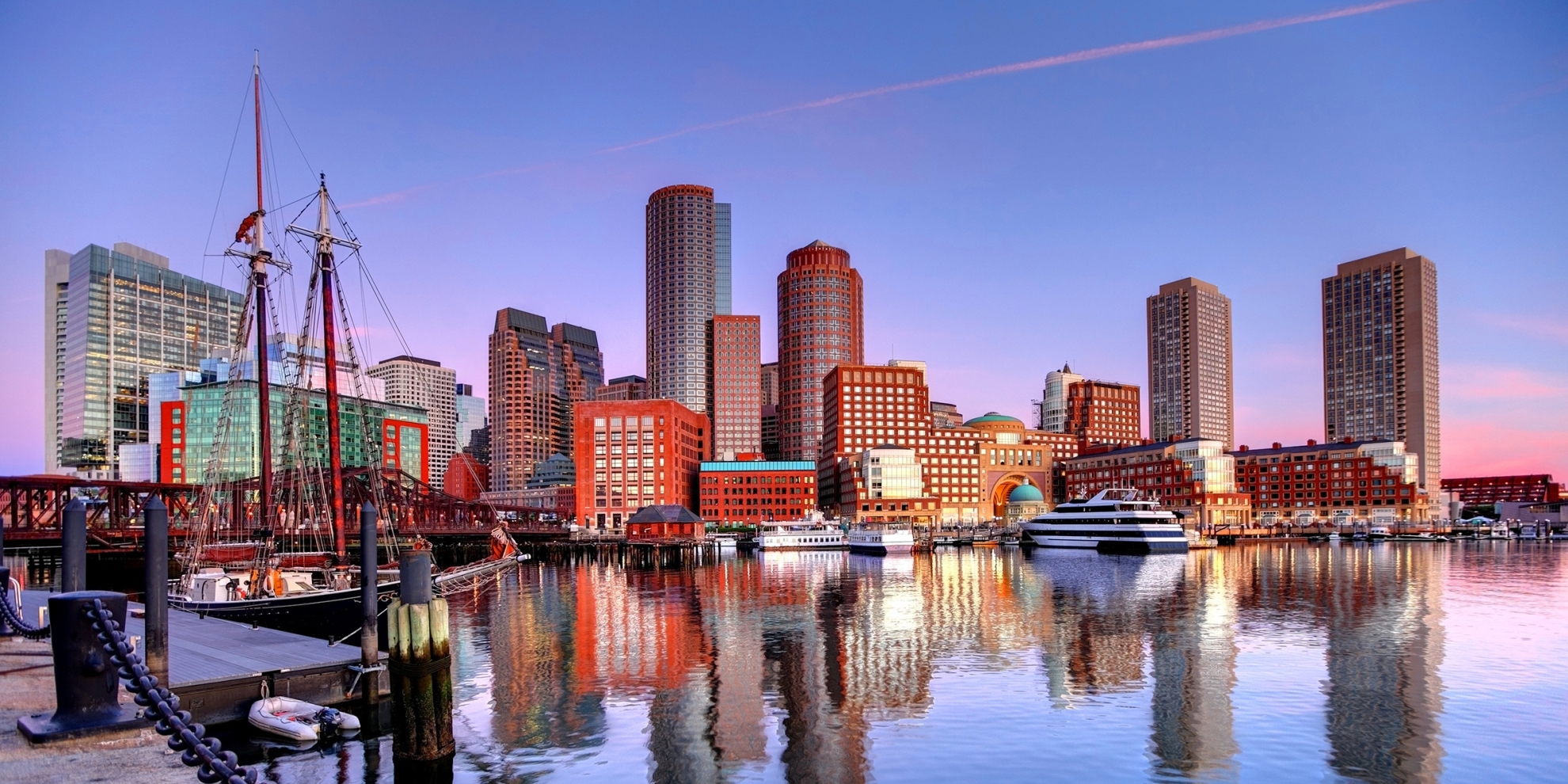 Downtown Boston, Massachusetts Skyline along the Boston Harbor Waterfront. Photo taken along the harborwalk in the South Boston southie neighborhood. 